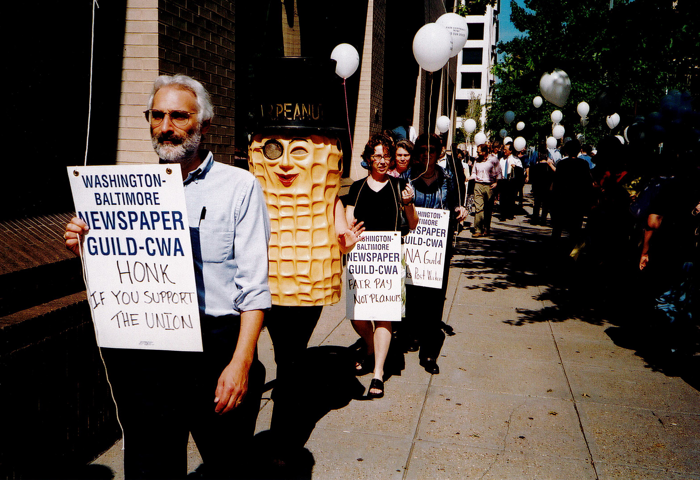 A guild member dressed as Mr. Peanut as part of a protest rally. A guild member dressed as Mr. Peanut as part of a protest rally.